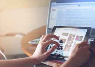 Hands typing on keyboard